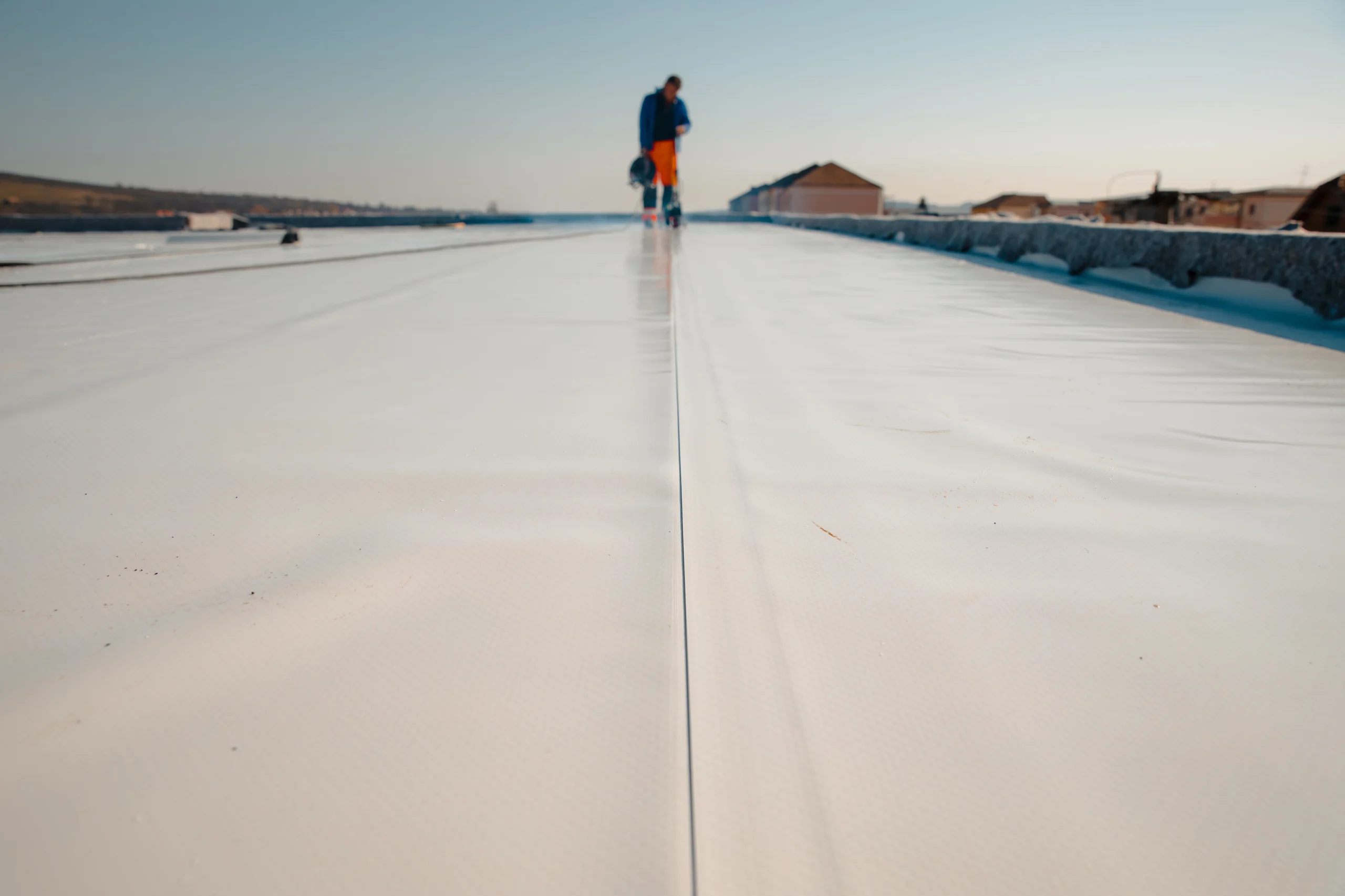 Commercial flat roof in Calgary showing wear from UV and freeze–thaw cycles